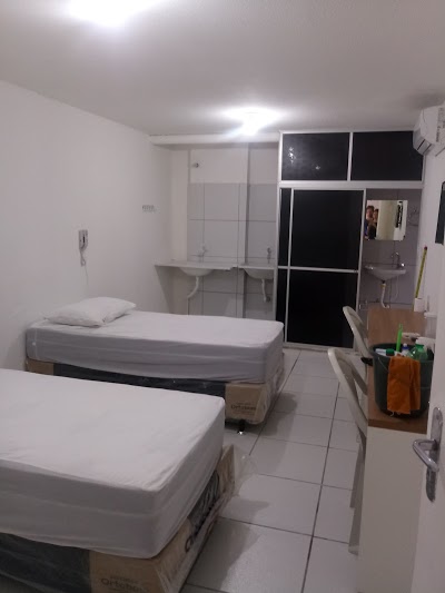 Quarto da Dantas Pousada com cama e estrutura funcional